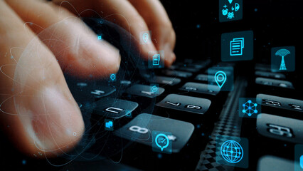 This image showcases a pair of hands on a keyboard with various digital icons around, symbolizing technology and connectivity in a contemporary work environment. Xenic