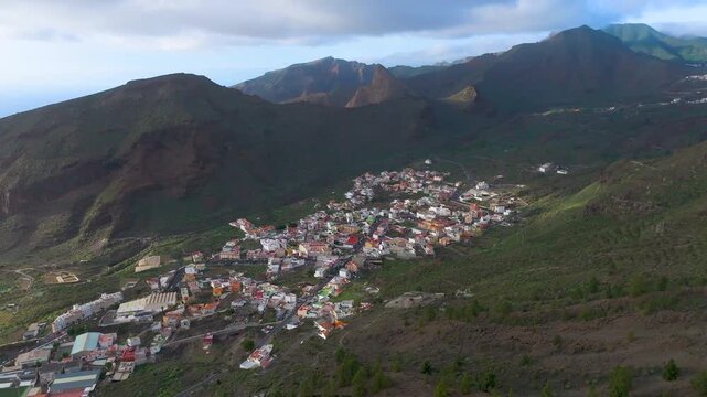 Aerial view of Tamaimo village in Tenerife surrounded by volcanic landscape