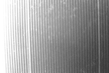 Seamless corrugated ribbed privacy glass transparent refraction texture. Trendy shiny silver, aluminum or chrome foil vaporwave background.