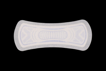 Sanitary napkin isolated on black background. Sanitary pad isolated over the black background