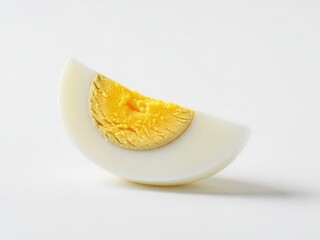 Perfectly cooked hard-boiled egg quarter with a bright yellow yolk on a clean white background