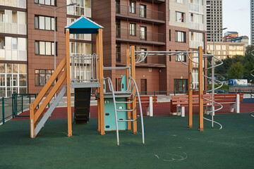 Modern playground for children in courtyard. Exercise equipment