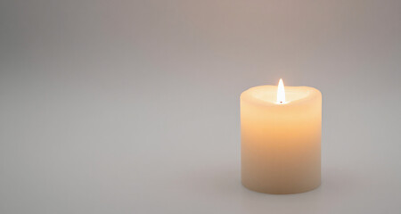 High-quality single candle isolated on light background, soft ambient light, negative space featuring a professional and clean aesthetic, perfect for creative projects, advertising, and m...