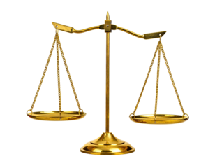 A golden, ornate balance scale isolated against a stark, black backdrop