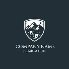 Shield Logo with Mountain Landscape Design.