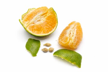 Fresh Partially Peeled Green-Skinned Orange with Segments and Seeds Isolated on White Background