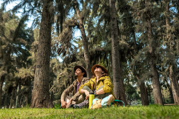 Tourists sitting in nature, feeling calm. Copy space