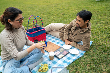 A couple spends the day at a picnic.