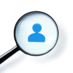 Magnifying Glass Enlarges Blue User Icon on White Background for Search and Identification Purposes