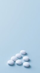 White pills on blue background, medicine and healthcare concept