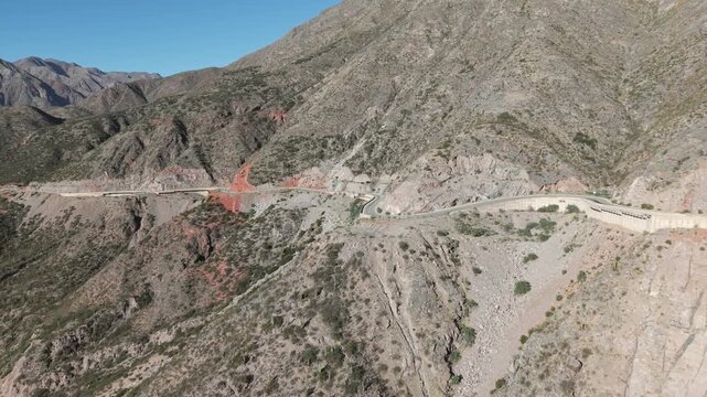 Drone fly at Cuesta de Miranda with curving legendary Route 40 mountain road, Chilecito, La Rioja, Argentina