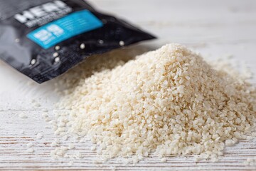 Pile Of White Granules On Wooden Surface