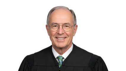 Middle aged man in judicial robes wearing glasses and striped tie smiling isolated on a transparent background