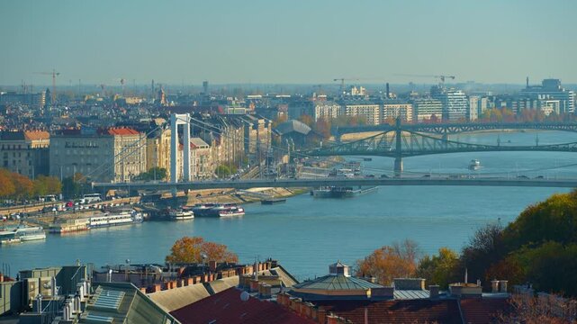 Panoramic view of Budapest and Danube River, city architecture, bridges and road traffic