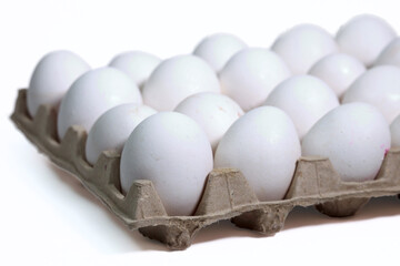 Fresh White Eggs Arranged In A Recycled Paper Carton. Farm Food Product Isolated On A Clean Background.