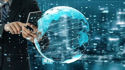 A business professional interacts with a smartphone while surrounded by a holographic representation of a globe and data, highlighting global connectivity in today corporate world. Xenic
