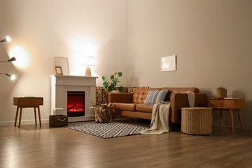 Fotobehang Ridders Interior of living room with sofa, glowing lamps, bedside tables and firewood near fireplace in evening  © Pixel-Shot