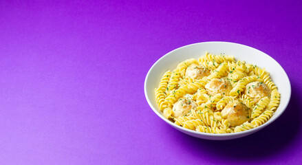 Pasta with chicken meatballs in a creamy sauce. Italian cuisine. Recipe.