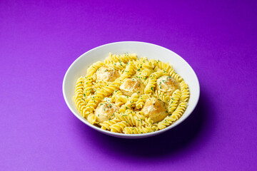 Pasta with chicken meatballs in a creamy sauce. Italian cuisine. Recipe.