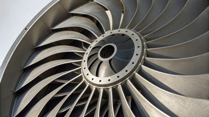 Fototapeta premium Geometric forms iconography visual. close up of metallic turbine with rotating blades, showcasing intricate engineering details