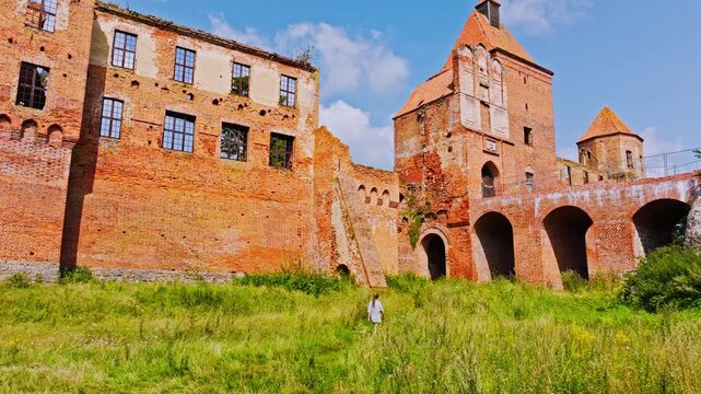Historic 14th century Gothic castle in Szymbark, Poland, framed by nature