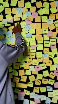 motivation sticky note was hanged on the glass.
