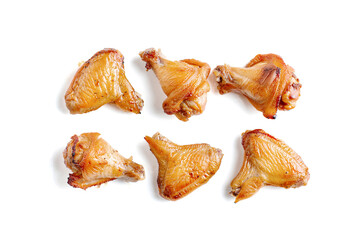 Grilled chicken wings on a white background.