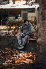 Homeless man experiencing poverty and cold on street
