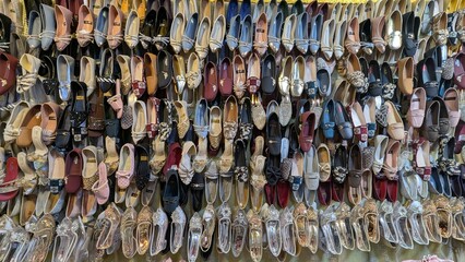 Row of colorful hand made traditional Rajasthan style shoes up for sale at street side in Area Hazro Attock. &lrm;November &lrm;28, &lrm;2025 