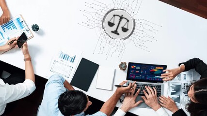 A diverse team collaborates over a table filled with data charts and legal symbols, reflecting innovation in business strategy and analysis in a modern workspace. Raster - Powered by Adobe