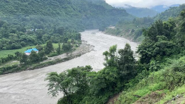 Heavy Water Flowing River Seen from Cliff, Powerful Mountain Stream Panning Shot