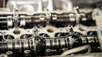 The engine of a car is shown in detail, with the cylinders and pistons visible. Concept of...