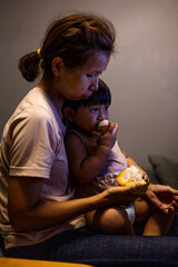 Mom And Toddler Are Eating Santol