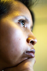 Southeast Asian Woman Gazing At Screen Close Up