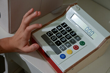 Little boy using calculator for calculations, Developing skills, Learning