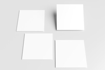 Blank white square paper mockups or square card isolated on a gray background.