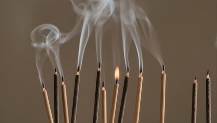 Incense sticks burning, producing smoke