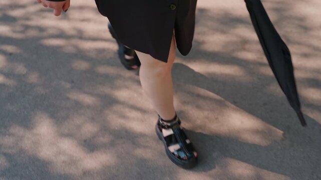 sunshine city walk, bright street stroll with style, walking confident through sunny city streets, lively scene of fashionable individual strolling confidently under sunny skies in bustling city