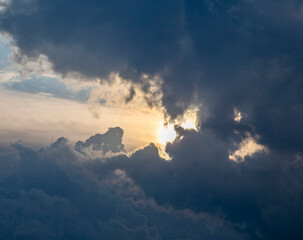 Sun Shining Through Clouds During an Afternoon Flight