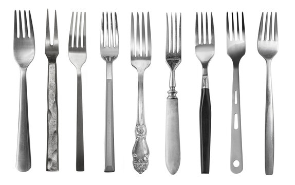 elevated photograph of a set of antique silver forks arranged in a row against a plain transparent background, shot in a studio with dramatic lighting.