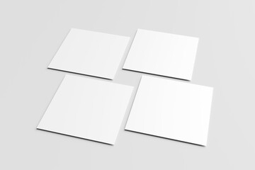 Blank white square paper mockups or square card isolated on a gray background.