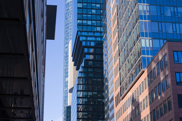 Looking up modern skyscrapers at financial district at German city of Frankfurt on a sunny autumn day. Photo taken November 22nd, 2025, Frankfurt am Main, Germany.