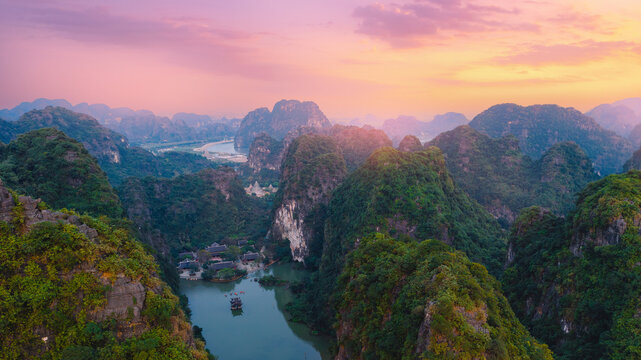 Scenic sunset over karst mountains and river in Ninh Binh, Vietnam