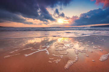 Beach sunrise over the tropical sea shore, ocean beach sunset landscape