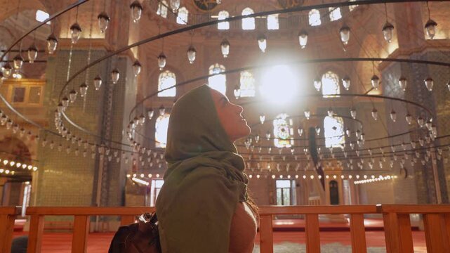 Woman wearing hijab explore inside a Mosque in Istanbul