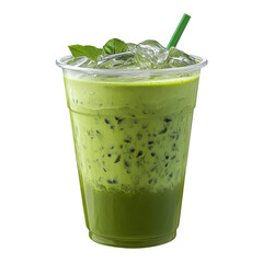 A cup filled with green iced matcha drink sits on a table. Ice cubes and mint leaves are visible on top