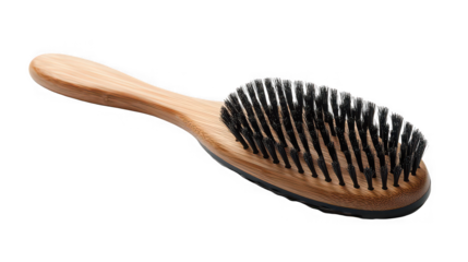 Natural bamboo hairbrush with dense black bristles for beauty and grooming concepts