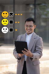Business customer satisfaction survey photo. Happy businessman holding a digital tablet or rating...