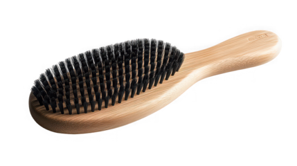 Natural wooden hairbrush with dense black bristles on a stark for beauty product display