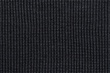 Soft black ribbed knit fabric pattern close up as background